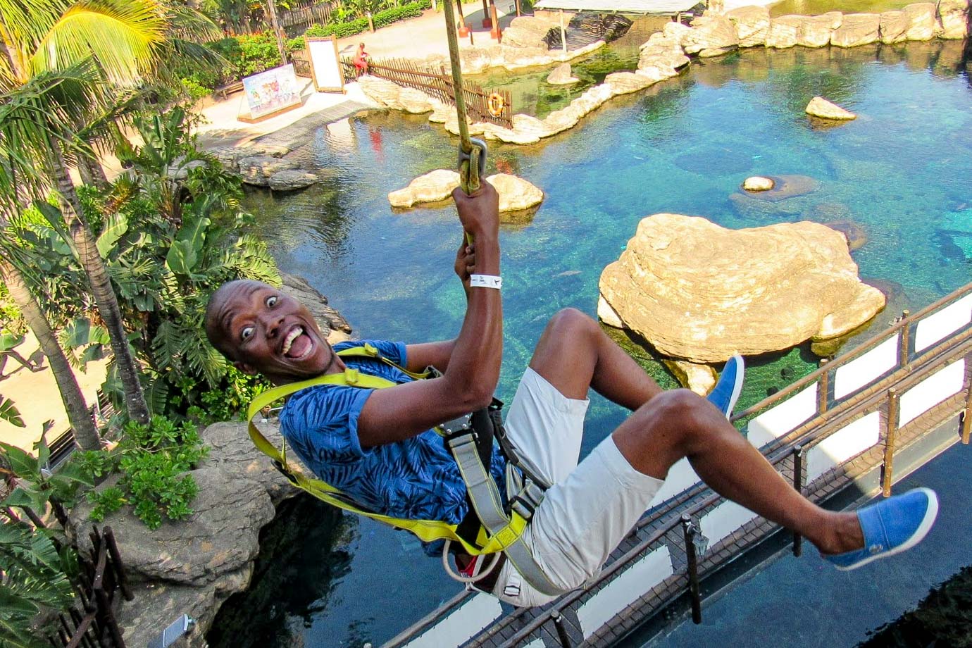 Man on zipline above uShaka