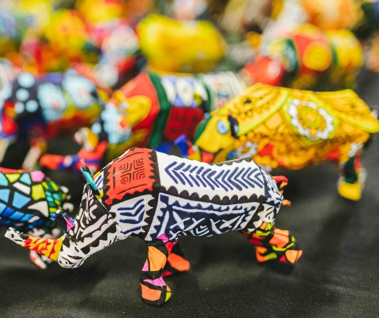 African souvenir, rhino figurines brightly painted