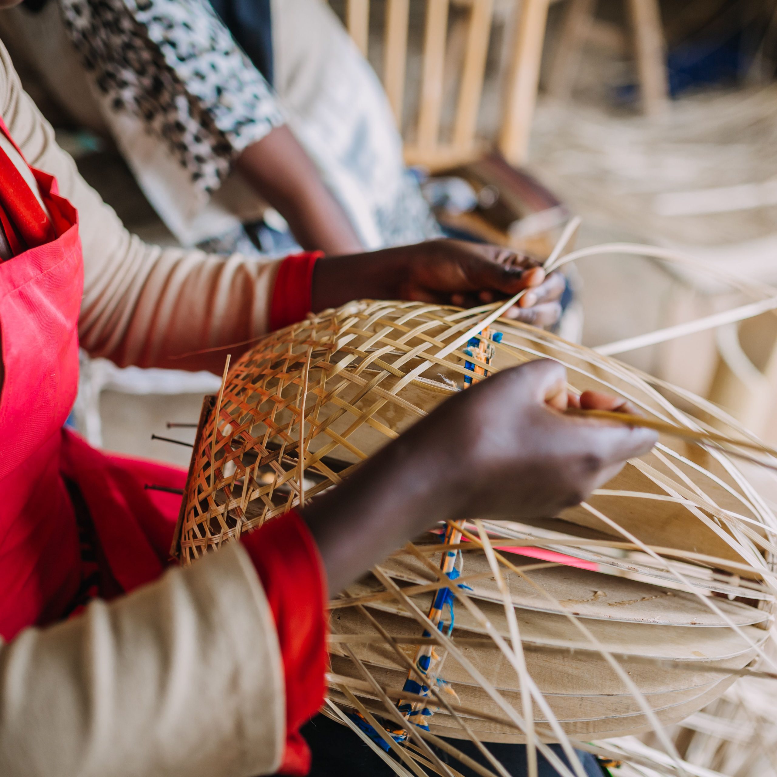 woman-weaving-a-basket-made-of-bamboo-in-rwanda-africa