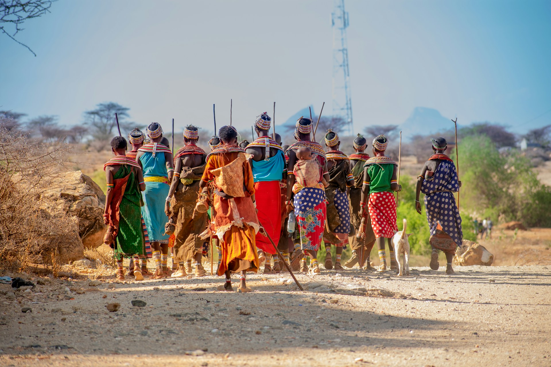 Group of Samburu women walking down dirt road in Kenya