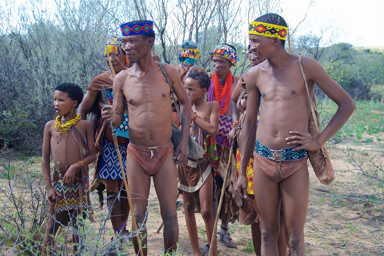 San Bushmen men and boys in traditional garb