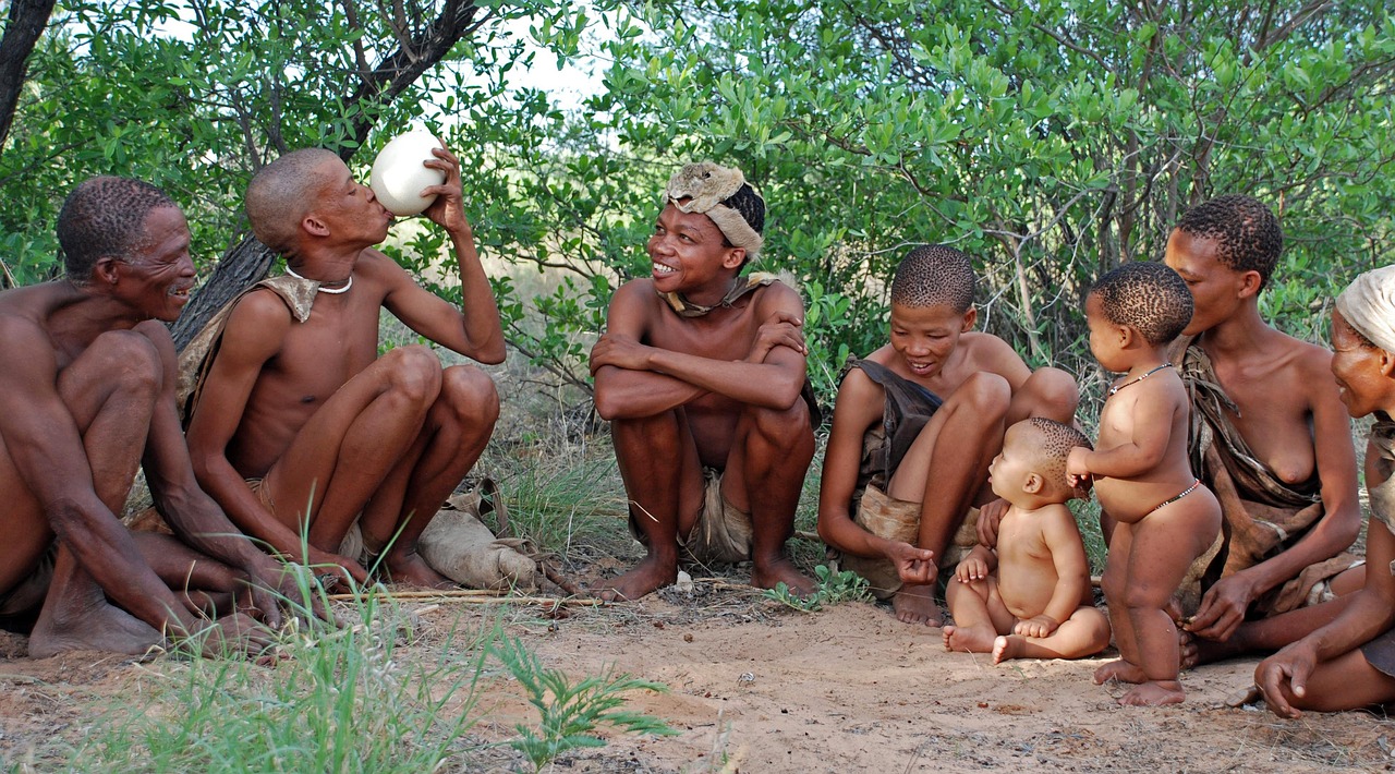 Group of San Bushmen seated in semi-circle