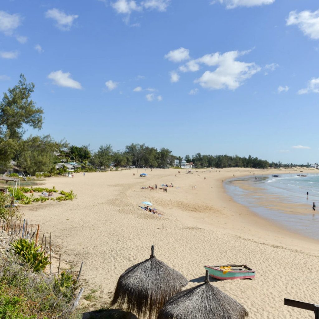 Slightly elevated view of curved beach of Tofo Beach, Mozambique