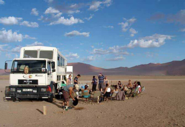 |bushman dancing at nigh|okavango-delta-boat|
