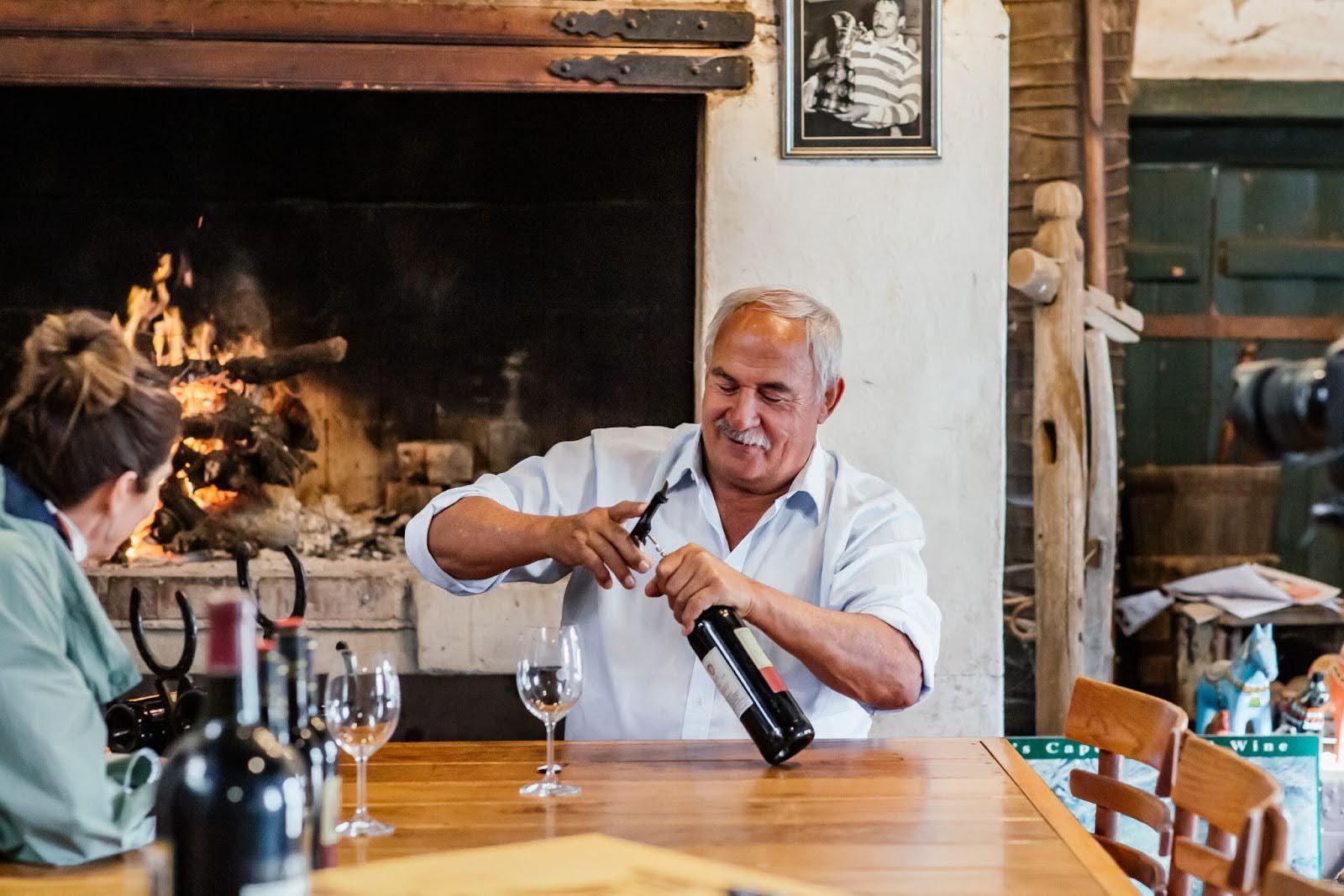 Hempies du Toit, winemaker at Annandale in Stellenbosch, conducts a wine tasting with a guest at the South African estate.