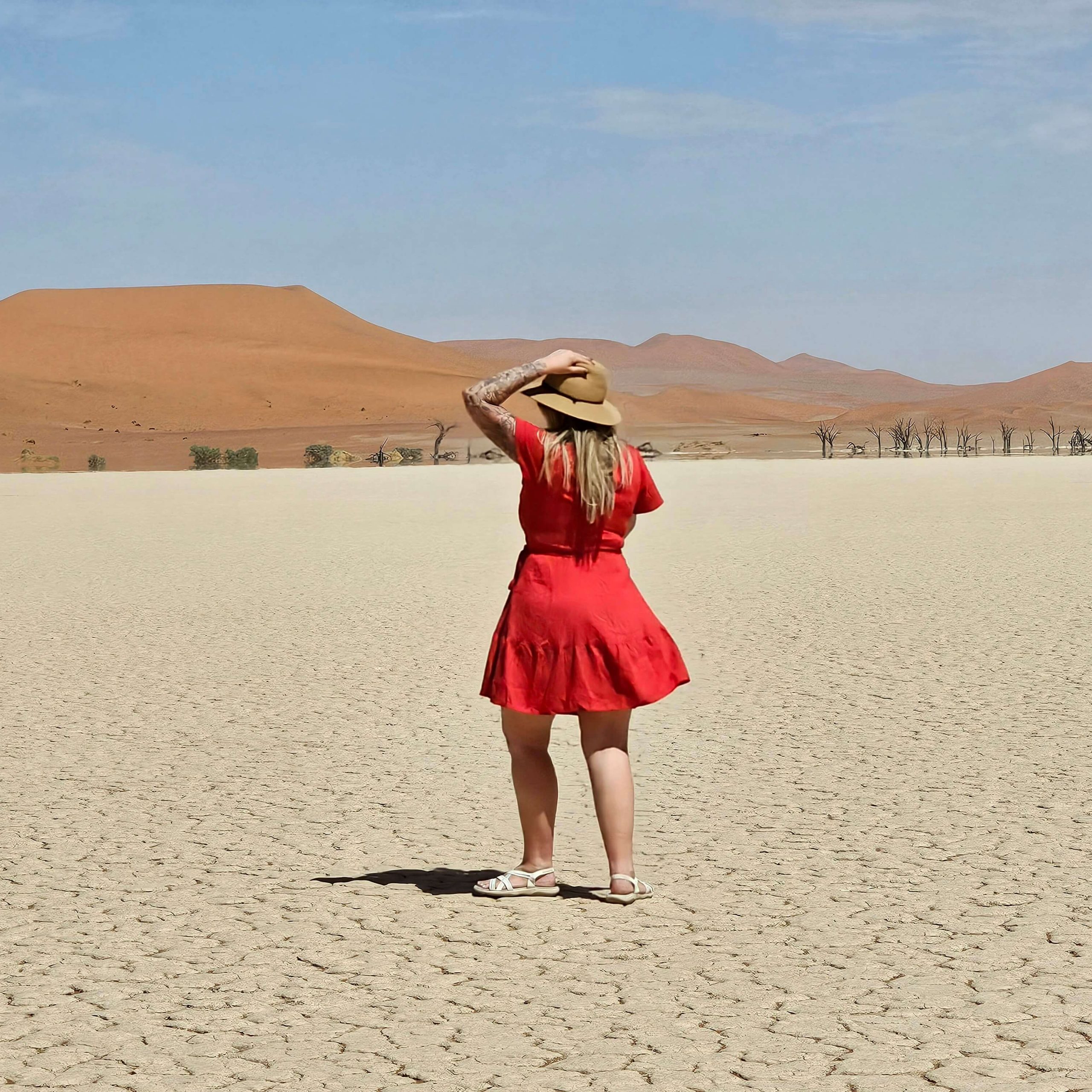 solo female standing in the middle of deadvlei namibia