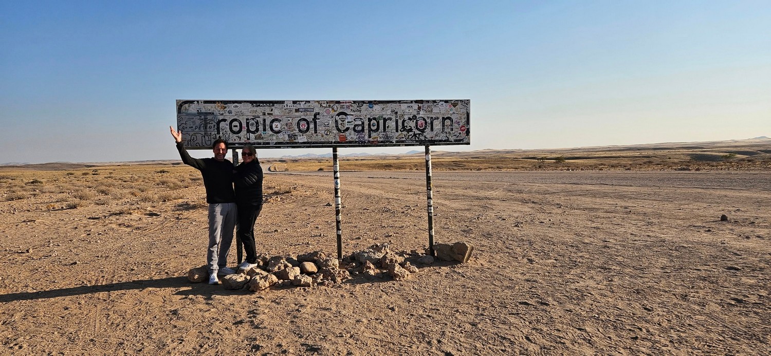 Happy traveller at tropic of Capricorn