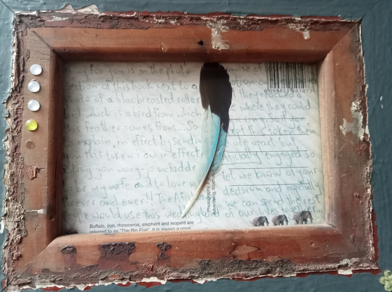The postcard Ralph sent to his girlfriend with a feather attached, asking her to marry him